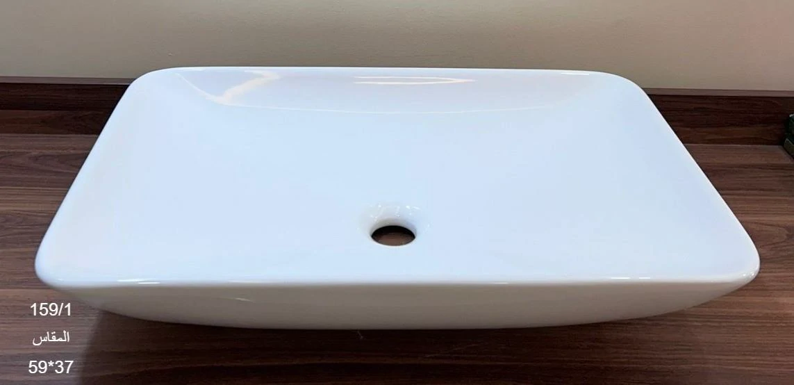 11 حوض ابيض مستطيل فوق الرخام - الصورة 1